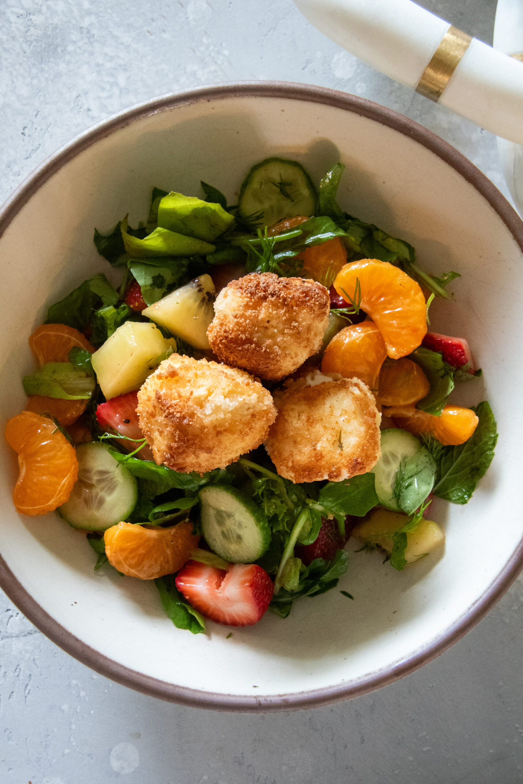 fruit salad with fried goat cheese